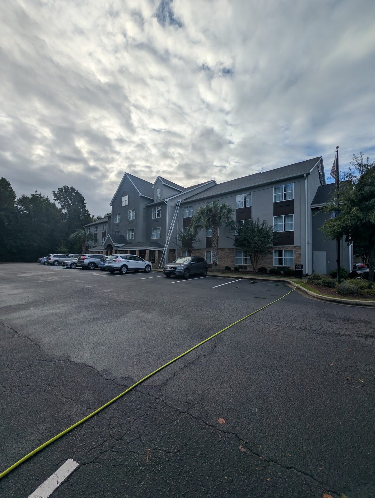A commercial building front before and after a Soda City wash