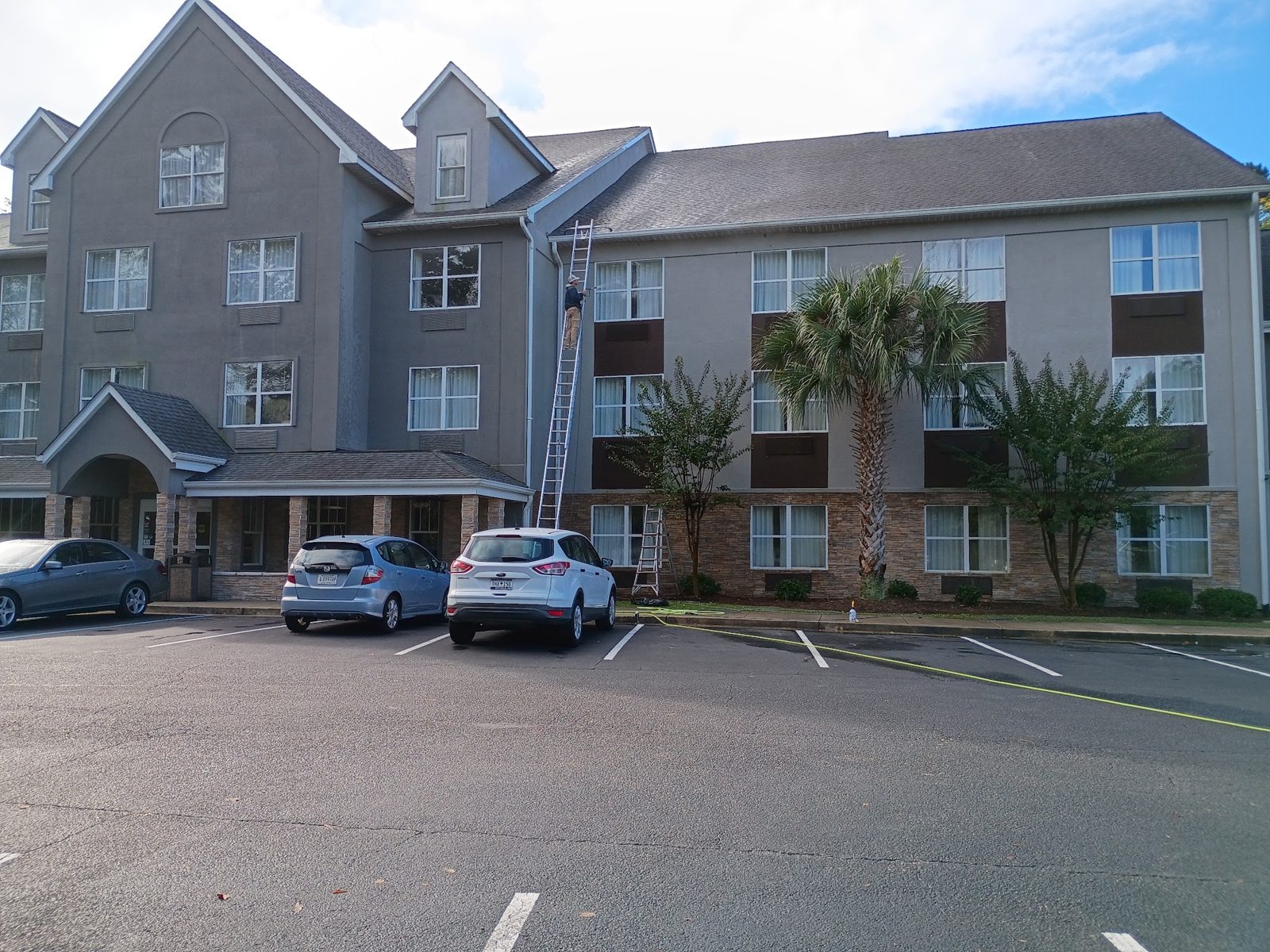 A commercial building front before and after a Soda City wash
